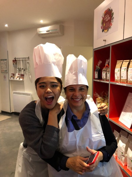 Dr. Gray and student in chef hats