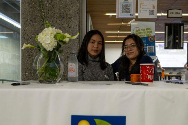 two female students at the interior design club table