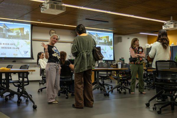 members mingling in the classroom