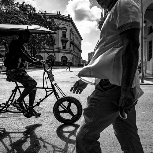 Black and white photo of humans on street