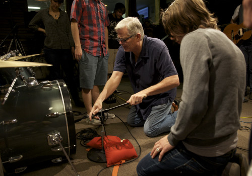 Forehan helping students in studio