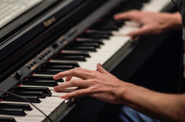 Hands playing piano