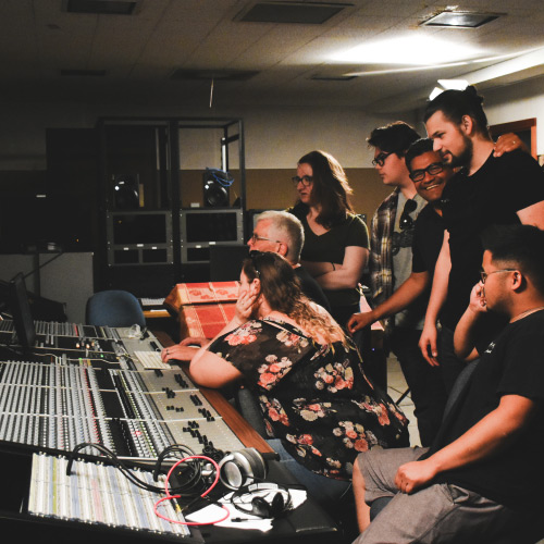 Students in recording studio with instructor