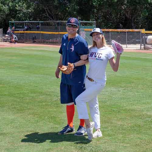 Heidi smiling in baseball field