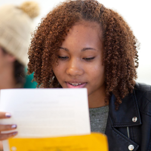 Female student looking at paperwork