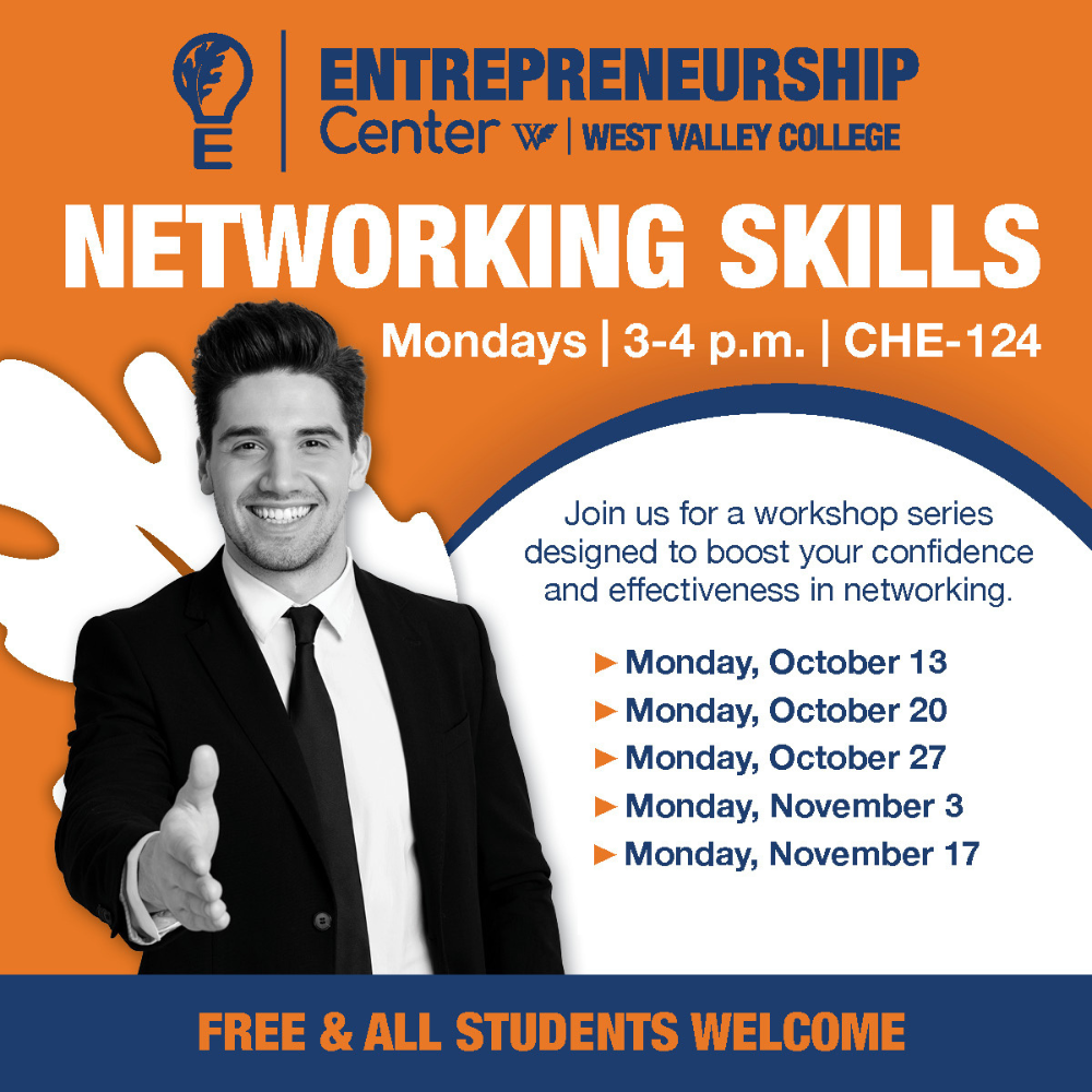 man with hand out for a handshake wearing a suit and tie