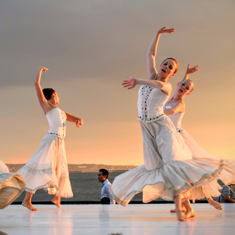 women dancing in white dresses