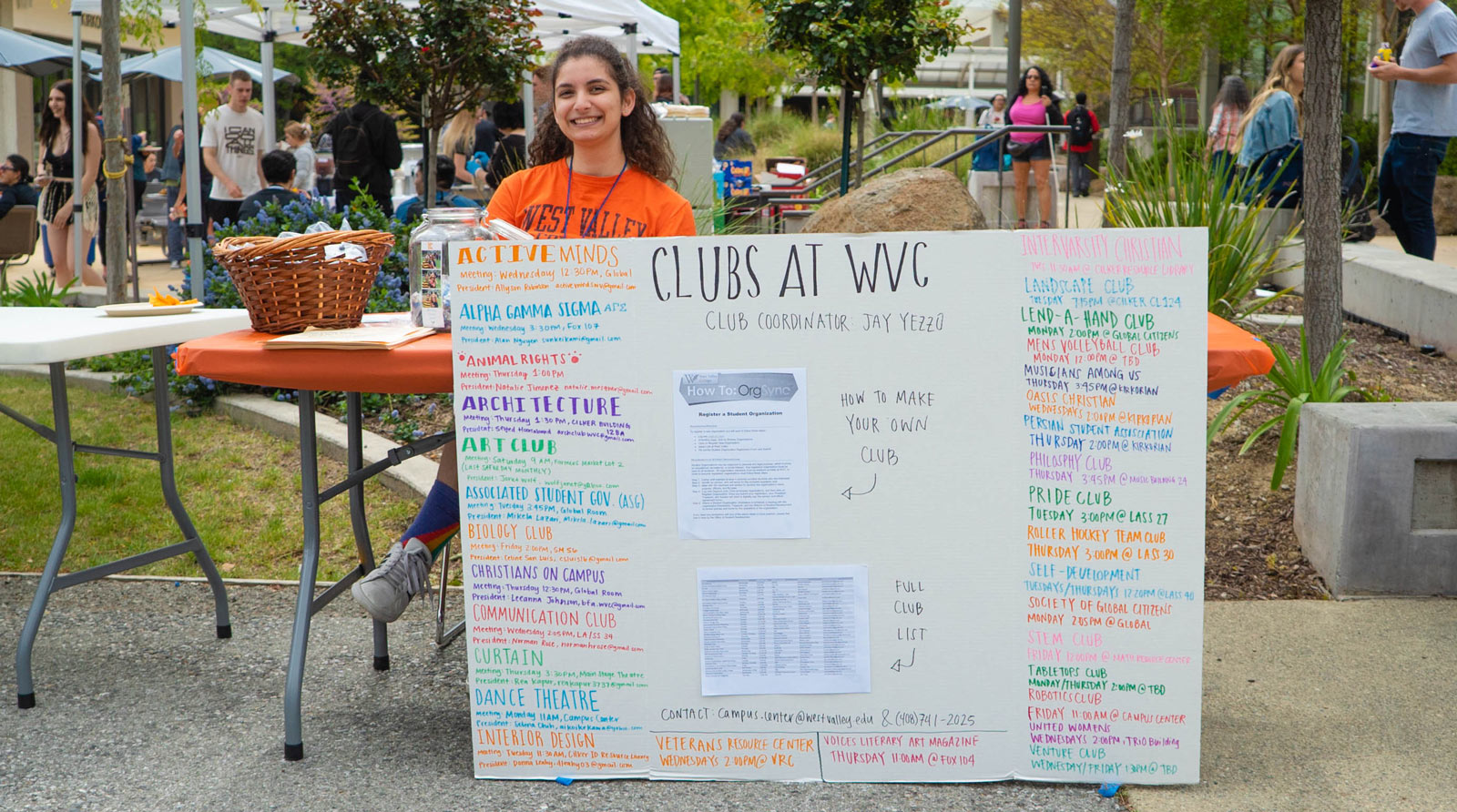Student with sign listing clubs