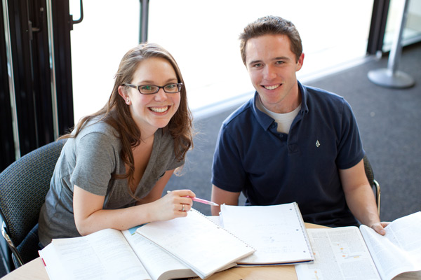 Two students smiling