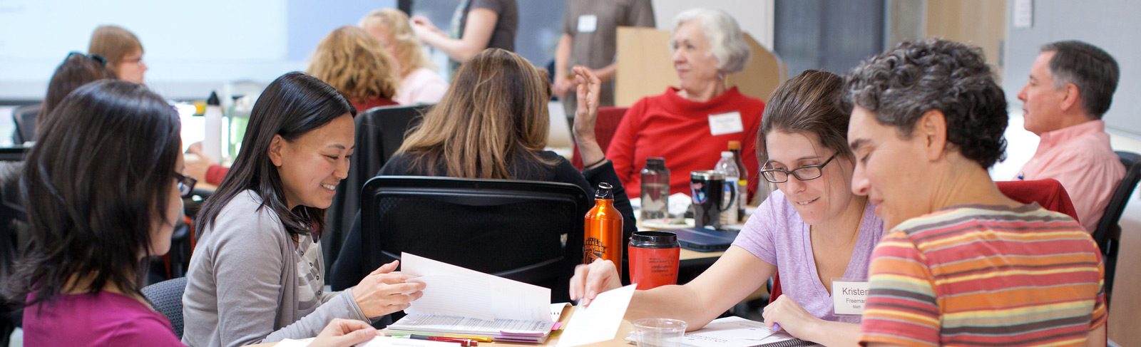 Faculty around table during training event