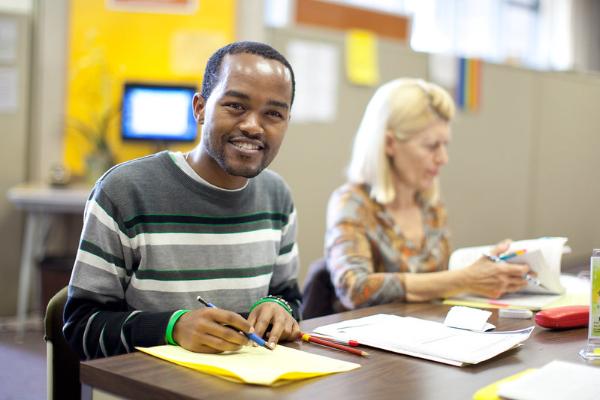 Student smiling in classroom