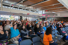 Convocation students throwing paper airplanes