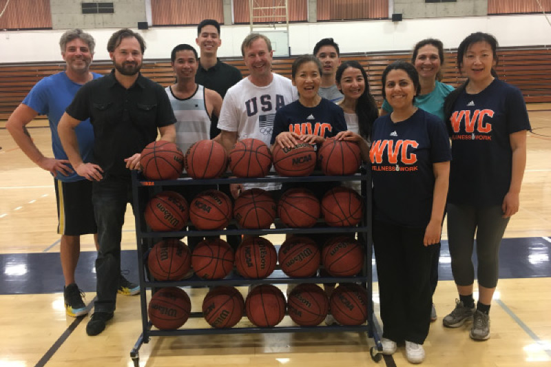 Employees getting ready to play basketball during Wellness at Work