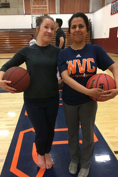 Two employees during basketball event