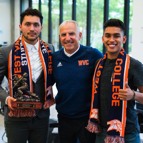 Student athletes with Gaspar during scarf ceremony