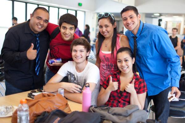 Student group with thumbs up