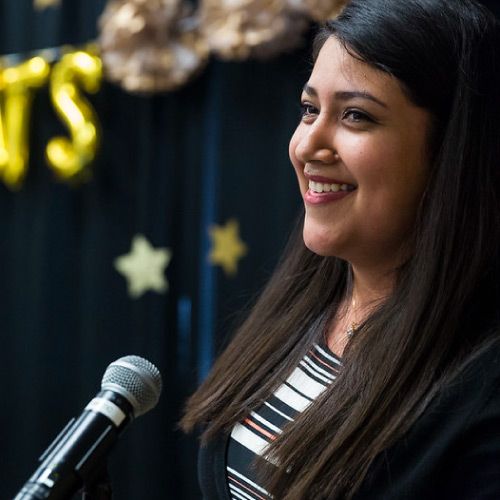 Female student smiling at ceremony