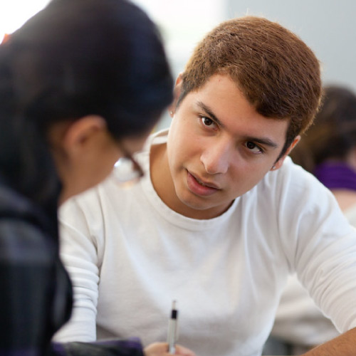 Male student receiving assistance