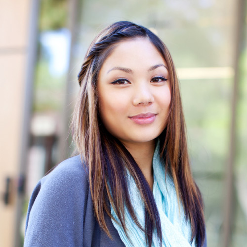 Smiling students sitting on West Valley campus