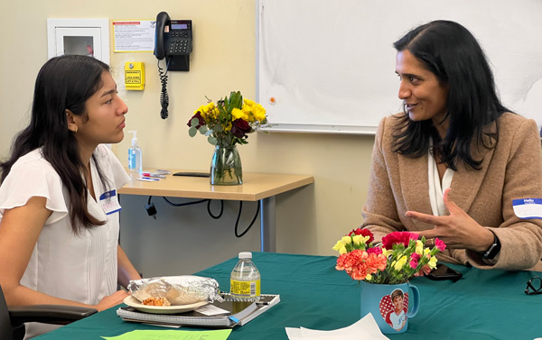 Student with instructor over lunch