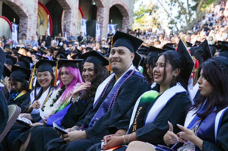 students wearing cap and gowns at the 2025 commencement