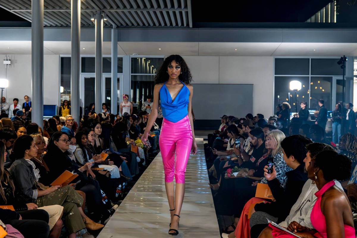 fashion show model walking down runway