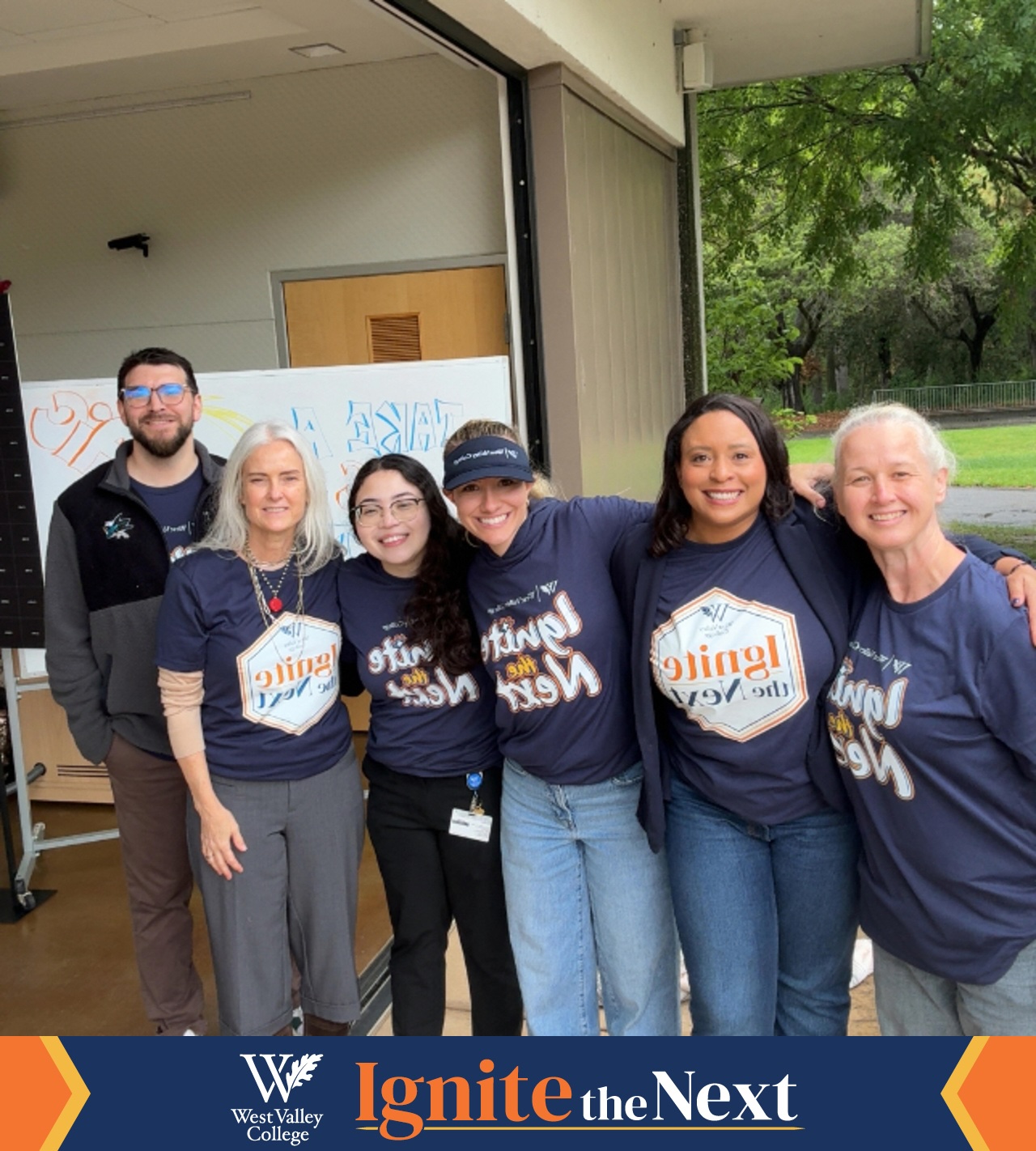 marketing and communications team wearing ignite the next tshirts