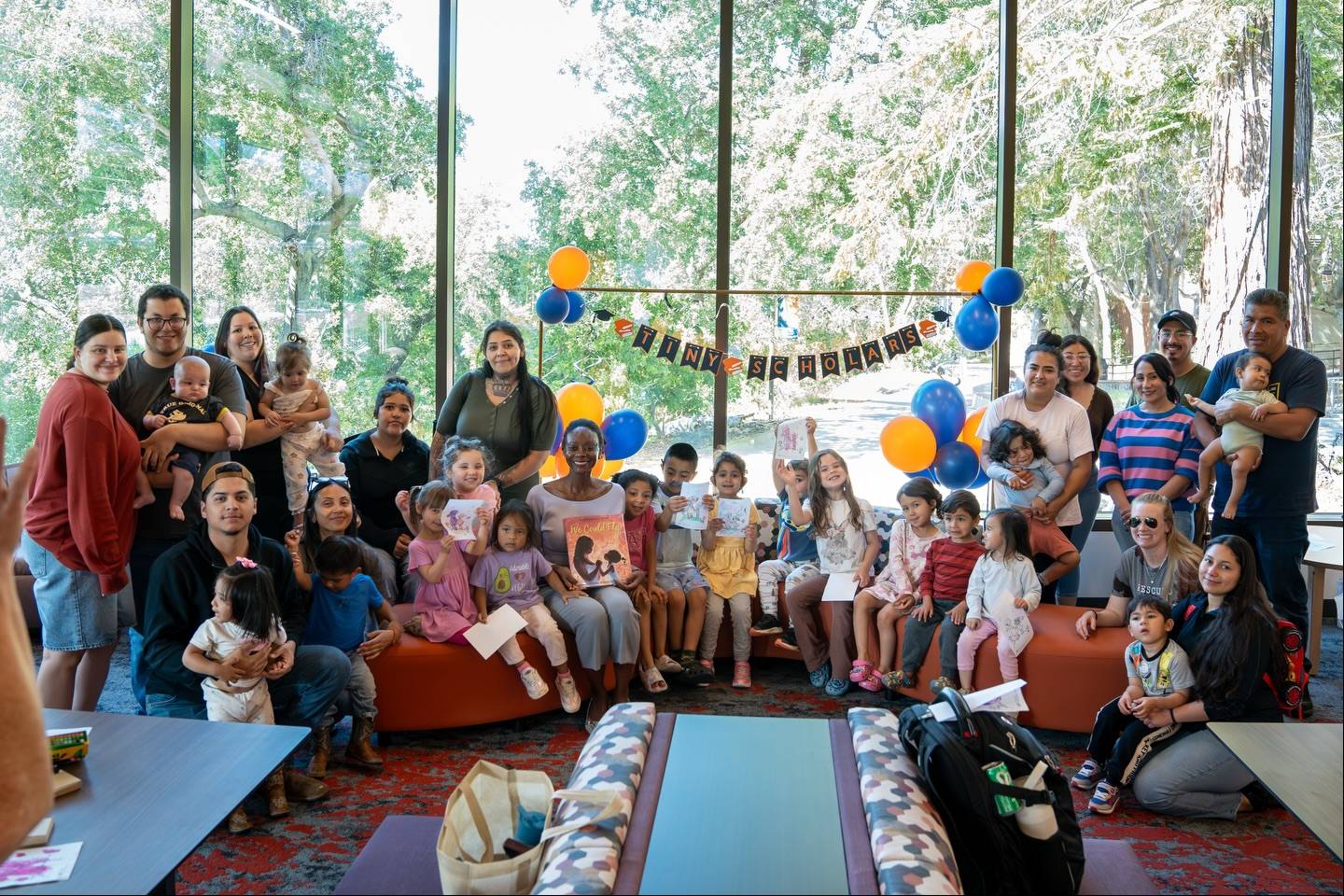 the first tiny scholars series event with a picture of parents and their kids with dr. jennifer taylor mendoza