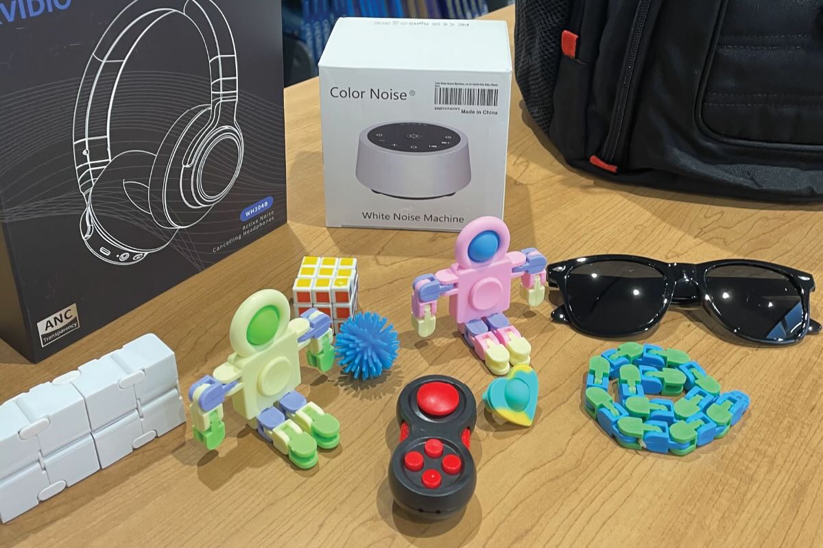 sensory kits with noice cancelling headphones, white noise machine, and fidget tools