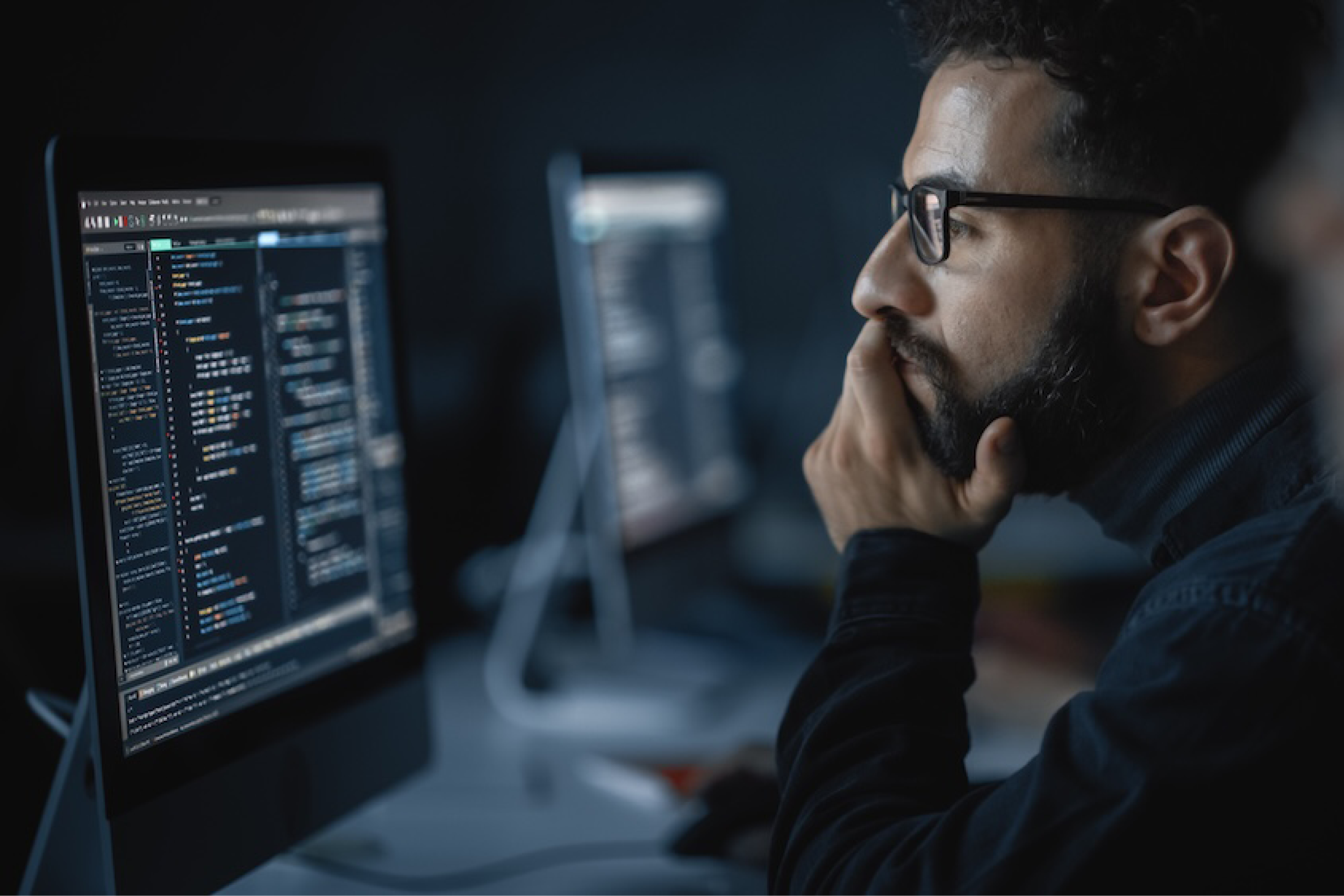 student looking at monitor with code