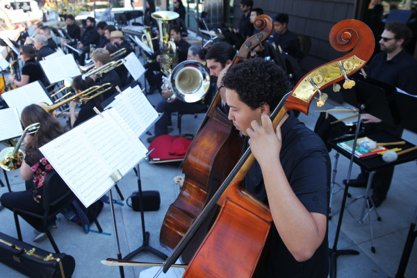 Student playing instrument Student playing instrument
