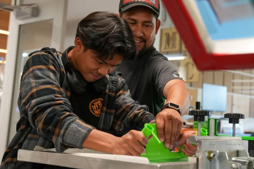student screen printing a shirt at cilker
