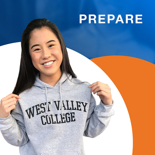 Smiling student in gray West Valley sweater