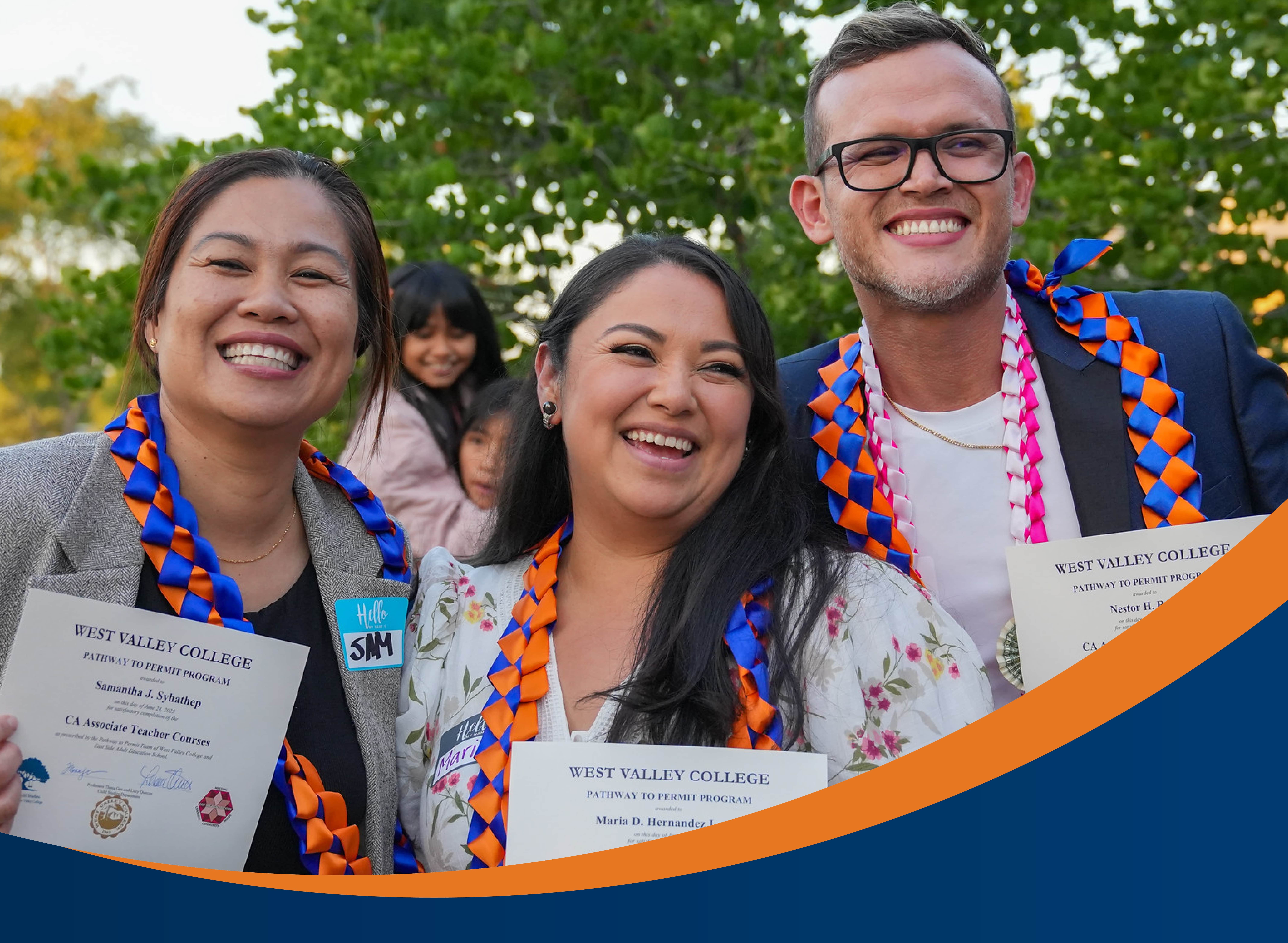 west valley college students (two women and one man) holding certificates