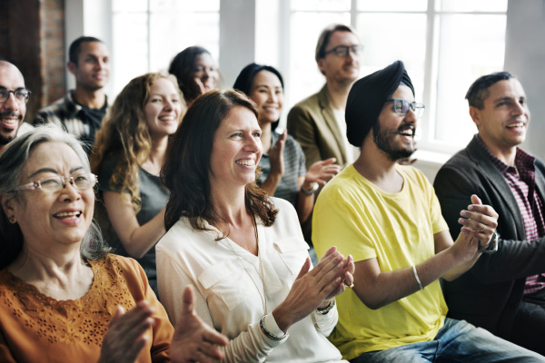 Happy group applauding