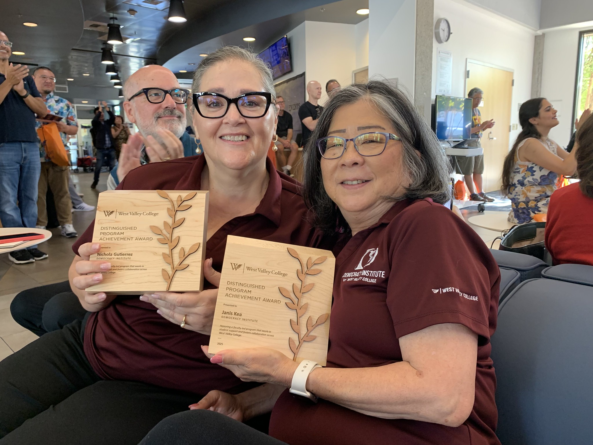 nichola and janis holding awards