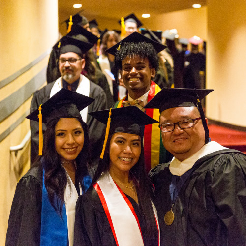 Students with counselor during graduation line up