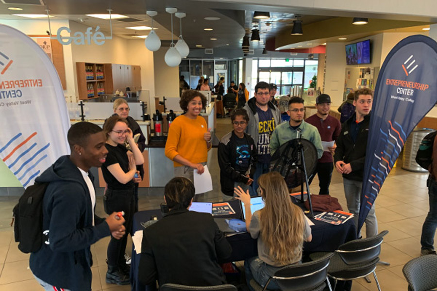 Students congregating around Entrepreneurship table in Campus Center