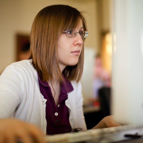 Student focused on computer