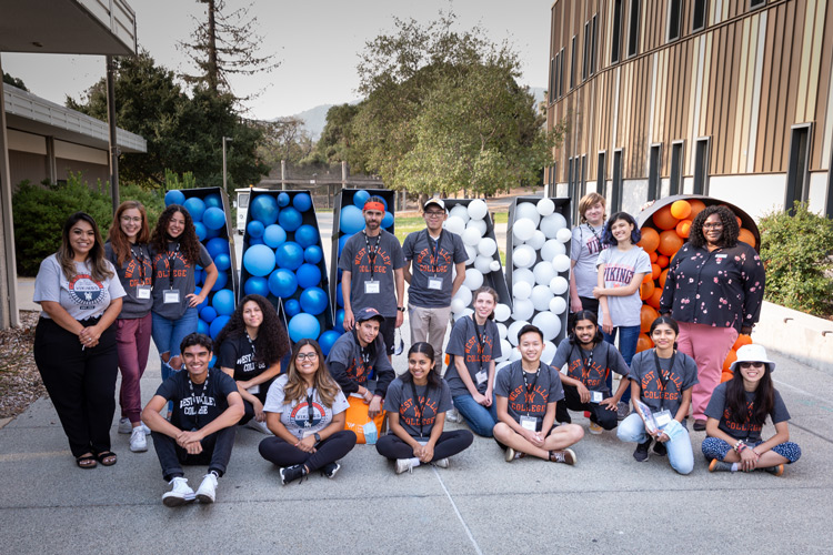 Students gathered in front of WVC balloons