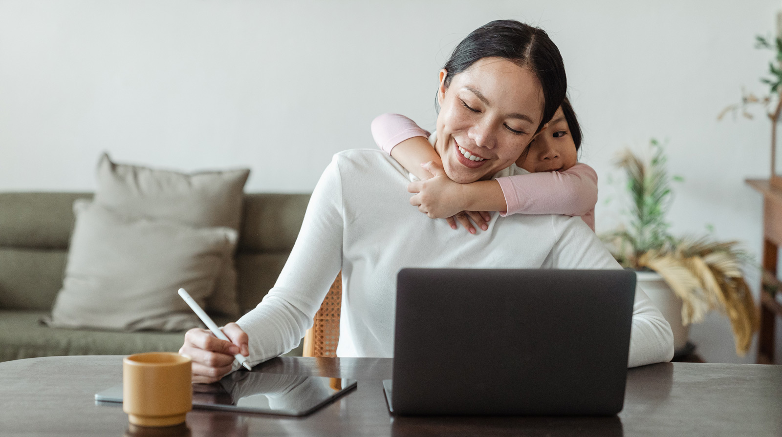 Mother doing homework with child hug