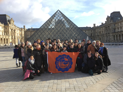 Study Abroad students in front of the Louvre Museum