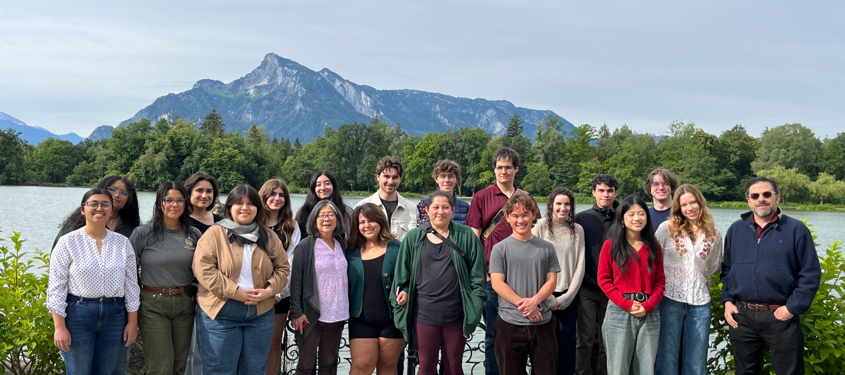 student and staff group photo in front of the mountains in salzburg